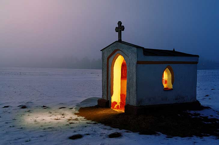 Small chapel lit from within