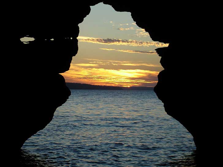 Sunset through rock arc